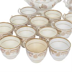 Late 19th century tea service, decorated in gilt with bands of seaweed type tendrils, thistles and cross hatch reserves upon a white glazed ground, comprising tea pot, twin handle lidded sucrier, milk jug, slop bowl, three serving plates, twelve cups and saucers and eleven side plates