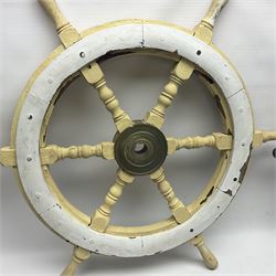 Two wooden ships wheels, each with six spokes and brass centres, to include a painted example and a smaller example, largest including spokes D66cm