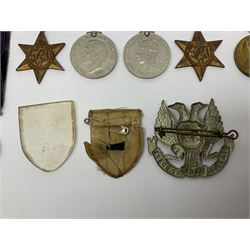 WW1 pair of medals awarded to 151761 Gnr. S. Loten R.A. with ribbons; four WW2 medals with ribbons; and small quantity of cap badges, medallions etc