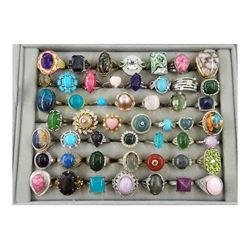 Fifty silver and silver-gilt stone set rings including labradorite, quartz, amazonite, kunzite, nephrite jade, jadeite, turquoise, amethyst, agate, aquaprase, topaz, morganite, pearl and amethyst