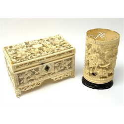19th century Cantonese carved and pierced ivory small trinket box, L13.5cm and a similar cylindrical vase on hardwood stand H11cm (2)