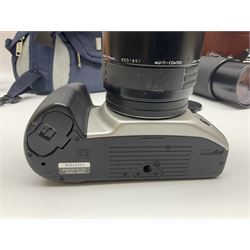 Four Minolta camera bodies, to include Dynax 500si, serial no. 94812651 with 'Signa Zoom 1;3.5-4.5 f=28-70mm' lens, Maxxum 300si, serial no. 97821665, with 'Tamron AF 80-210mm' lens and Dynax 300si, serial no 01603265'  with Minolta AF Power Zoom 35-80mm 1;4' lens, etc, together with Pantax MV1 camera bodies and other camera equipment 