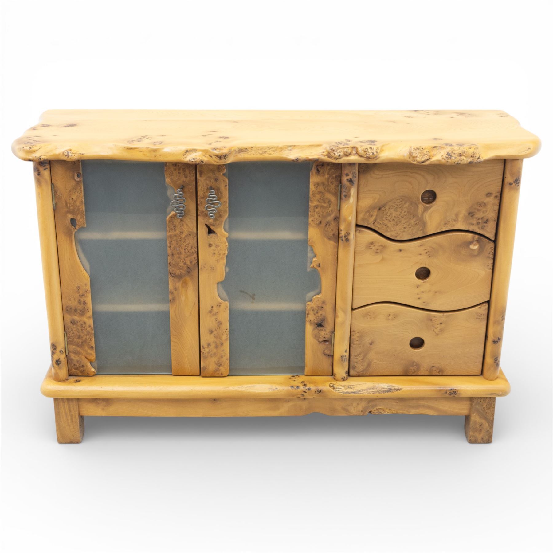 Paul Hodgkiss Designs of Glasgow - contemporary figured elm sideboard, burred elm organic form top, with frosted glass cabinet wrought metal handles revealing a fixed shelf interior, with three shaped drawers enclosing a fitted cutlery drawer, raised on square block feet 