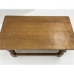 'Rabbitman' oak coffee table, rectangular adzed top on octagonal supports joined by plain stretchers, with carved rabbit signature, by Peter Heap of Wetwang