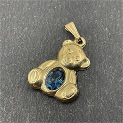 Three 9ct gold stone set rings and a 9ct gold stone set teddy bear charm/pendant 