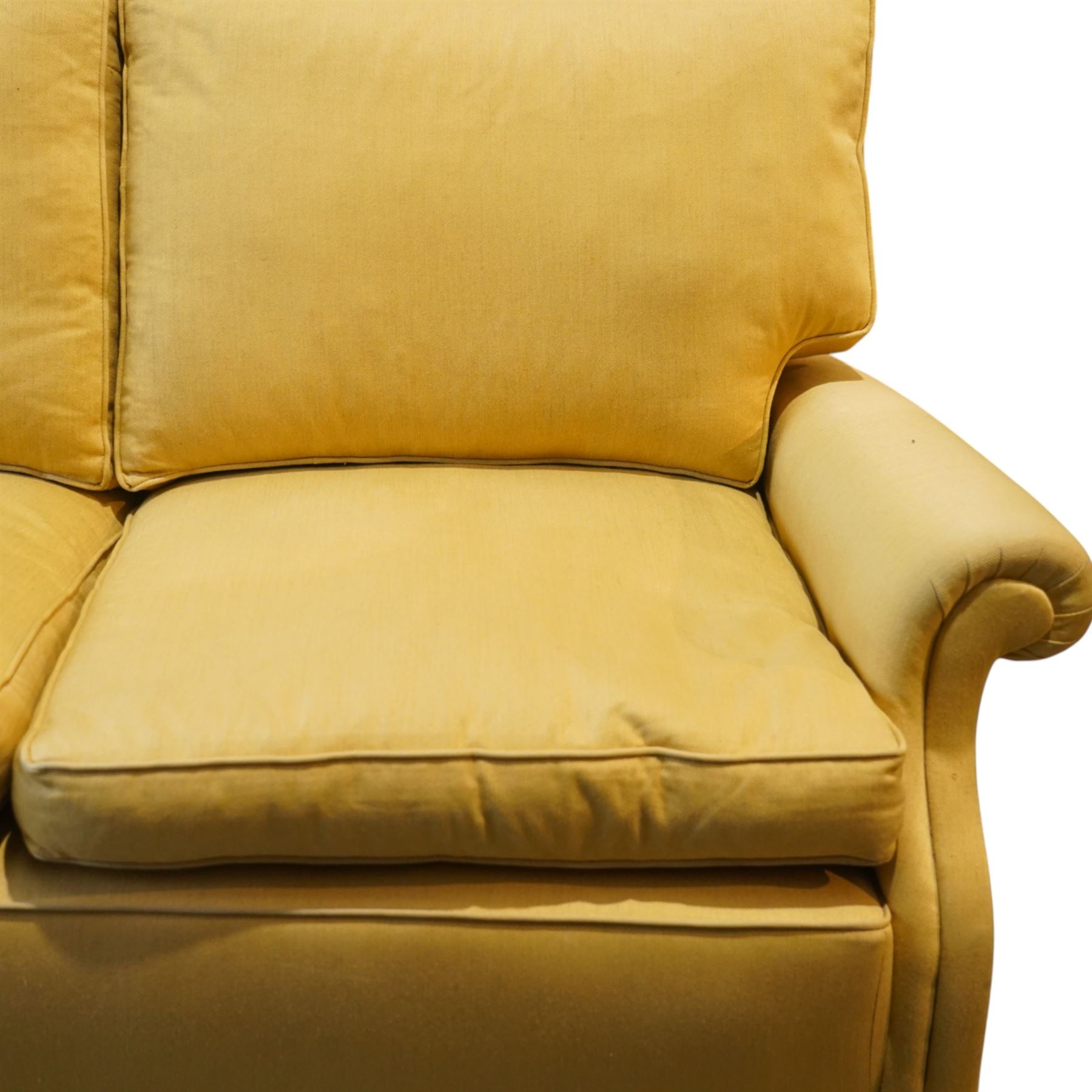 Pair of mid-20th century traditional two seat sofas, loose cushioned seat and back upholstered in pale gold fabric, on turned supports