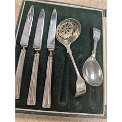 Two silver mounted button hooks and a shoe horn, three silver handled knives, silver hand mirror mount, two silver plated trophies, etc 