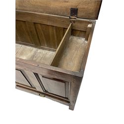 Georgian oak mule chest, moulded rectangular hinged lid over quadruple fielded panel front, the frieze inscribed '17 A Y 57', fitted with two drawers, panelled ends and back, on stile supports