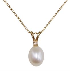 Gold single stone pearl and diamond pendant, stamped 14K, on 9ct gold necklace