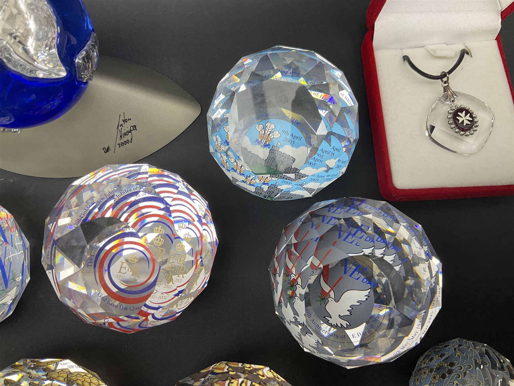 Swarovski Crystal paperweights, to include a globe with dove to the top, pyramid shapes etc, together with a large collection of boxes and stands  