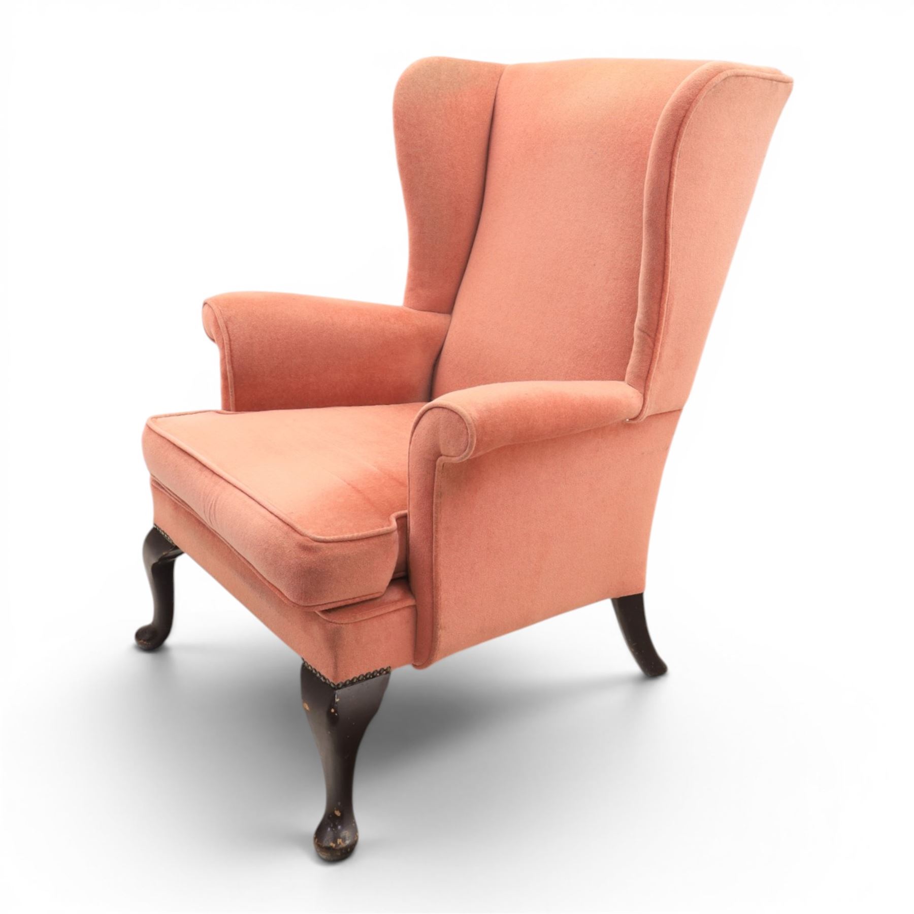 Parker Knoll - mid-century armchair suite, 'Model N30' recliner armchair with headrest and deep buttoned seat and back raised on castors, a wide armchair with deep button back and seat raised on castors, a wingback chair with flared scrolled arms, raised on cabriole supports