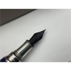 Montegrappa Emblema fountain pen, the blue pearl marbled barrel of octagonal form with silver mounts stamped 925 and silver mounted cap with 1912 emblem and clip with roller, in box, L13.5cm