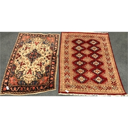  Persian style beige ground rug, central medallion, repeating border (169cm x 105cm) and a red ground rug (W169cm x 122cm) (2)  