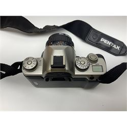 Four camera bodies, to include, Ricoh KR-10 serial no. 38826, Pentax MZ-M serial no. 4185969 with 'SMC Pentax- M 1:3.5 28mm' lens, Canon EOS500 serial no. 080927, with 'Sigma Zoom 100-300mm 1:4.5-6.7 DL'  lens etc, with other camera lenses and equipment 