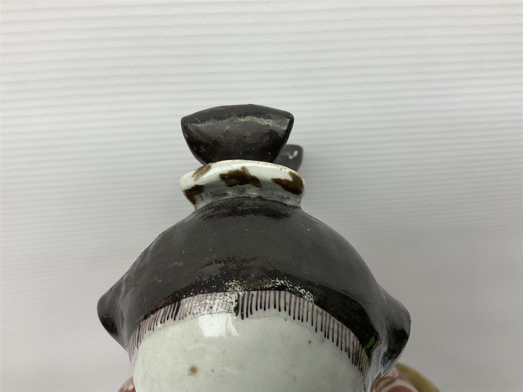 Large Japanese Imari porcelain figure, modelled as a Bijin, wearing a long kimono decorated with apple blossom and leafy branches on a white ground, with gilt detailing, possibly Edo period, H63cm