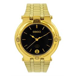  Gucci gold-plated quartz wristwatch, Ref. 9200M, black dial with date aperture, on integral gold-plated strap, boxed with additional links and grantee card dated 1999