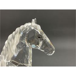 Five Swarovski Crystal horses, comprising stallion, rearing horse, pair of horses playing and Arabian stallion, each with frosted manes and tails, together with a small Swarovski Crystal galloping horse, the mane, tail and base with smoky tint