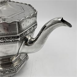 Victorian silver four piece tea service, comprising teapot, teapot stand, twin handled open sucrier and milk jug, each of octagonal form with foliate bud border and engraved decoration including crest to canted panels, and vacant panels, the teapot with ivory finial to the hinged cover and later wooden handle, hallmarked Edward Barnard & Sons Ltd, London1896, teapot including finial H15cm, milk jug including handle H16cm, teapot stand W11.5cm

This item has been registered for sale under Section 10 of the APHA Ivory Act