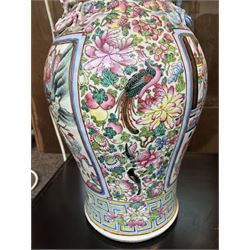 Large pair of 19th century Cantonese famille rose vases, each painted with various courtly scenes, including a display of warriors fighting on horseback before an official and his attendants, double Buddhist lion handles and applied at the shoulders with chilong, the lower band painted with Greek key motif, H58cm (2)