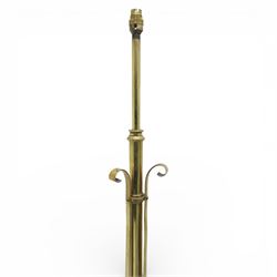 Arts and Crafts copper and brass standard lamp, in the manner of W A S Benson, slender tubular column with adjustable height mechanism, applied copper scroll brackets, circular weighted base with copper struts and stylised feet