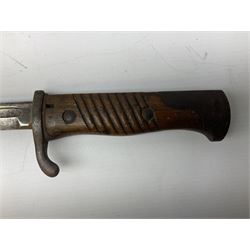 German Model 1898 bayonet 2nd pattern, the 52cm fullered steel blade inscribed Simson & Co to the ricasso, two-piece wooden grips and steel mounted leather scabbard 67.5cm overall