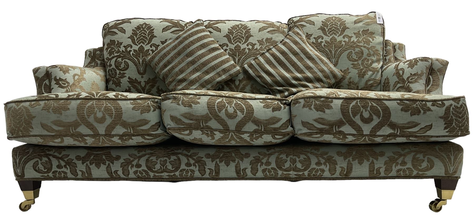 Wade - 'Kempston' three seat sofa, upholstered in chenille fabric with brocade pattern, raised on mahogany finish square tapering block feet with heavy brass castors