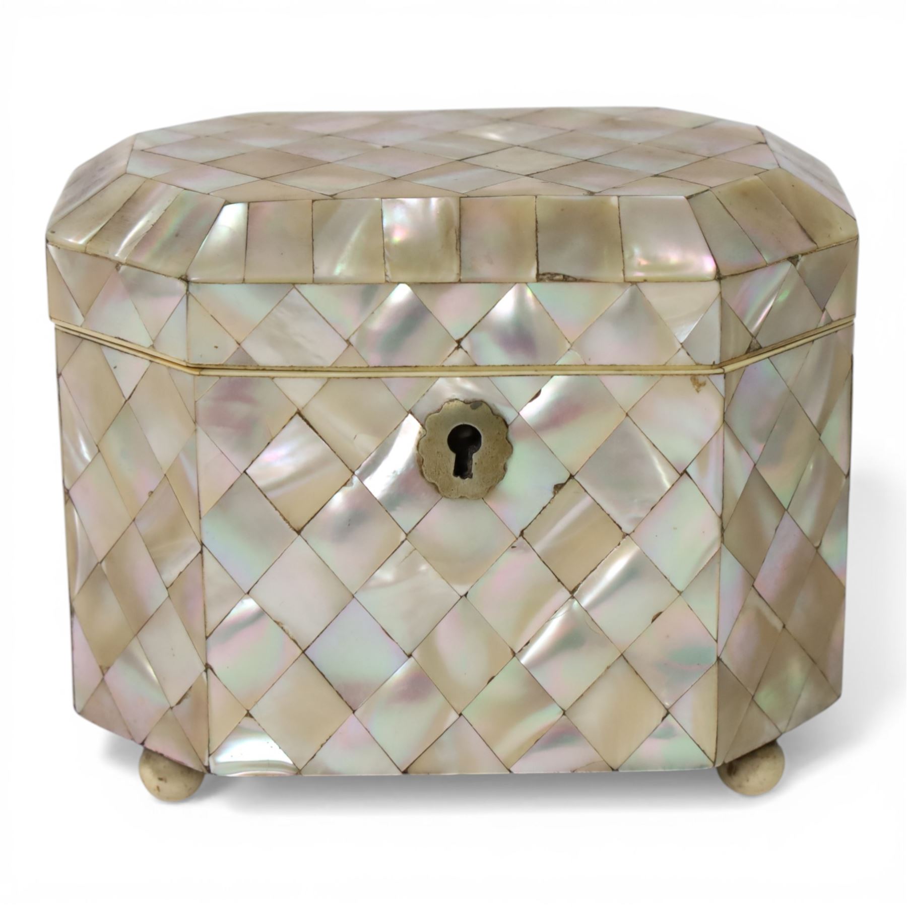 19th century mother of pearl tea caddy, of rectangular form with canted corners, the hinged lid enclosing a single lidded compartment, raised upon bun feet, H11cm D10cm L13cm
This item has been registered for sale under Section 10 of the APHA Ivory Act 