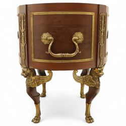 An imposing and richly adorned Empire Revival jardiniere of circular form, decorated with finely cast gilt bronze laurel garlands and floral swags, interior with a modern brass liner, sides with gilt bronze carrying handles, raised on three tripod legs with classical caryatid masks with wings terminating in lion paw feet, circa 1900

Provenance: This jardiniere formed part of the original furnishings of the opulent Empire Room at Kinloch Castle, built by industrialist George Bullough in 1900.

An original inventory number, ‘X954’, is inscribed on one facing, verifying its presence in the Kinloch Castle collection. This jardiniere epitomises the lavish taste of the Edwardian elite and the high standards of craftsmanship employed in the furnishing of Kinloch Castle, the first private home in Scotland to be lit by electricity and famed for its extravagant interiors.


