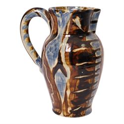 David Garland (b.1941) jug, decorated in a blue and brown glaze, with leaves and abstract ...
