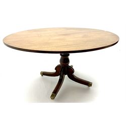 George III oval mahogany breakfast table, turned column on four shaped brass capped supports 