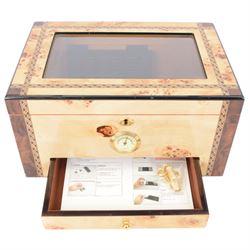 Cigar humidor, of high gloss birdseye maple veneer, the lid with central glass panel, brass handled draw to the front, fitted with a hygrometer, H18cm D24cm 