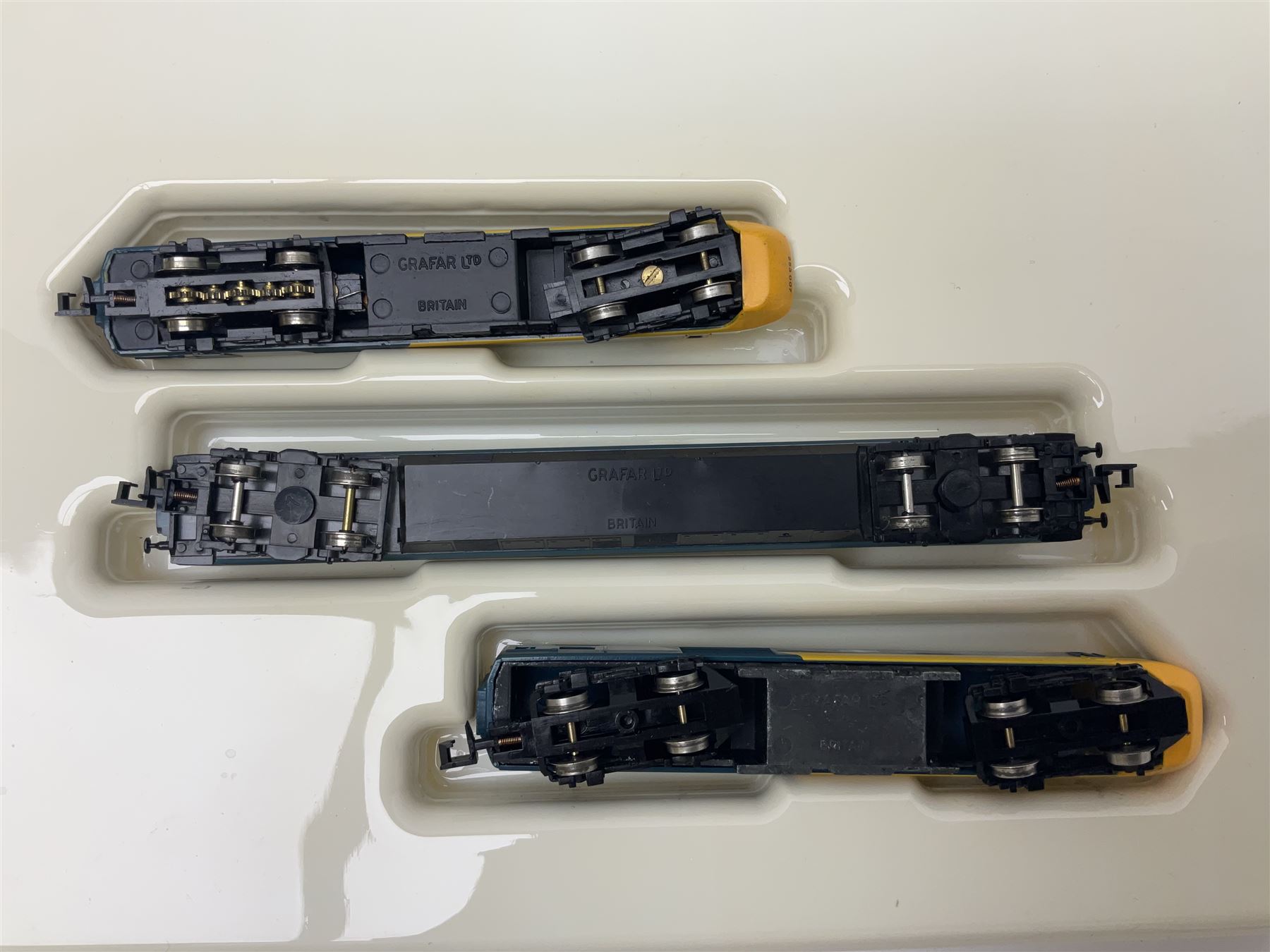 Graham Farish 'N' gauge -No.8125 HST Inter-City 125 set BR Blue Livery; No.8205 Inter-City Class 20 Diesel locomotive No.20142; both boxed; 0-6-0 Diesel Shunter No.D4019; and Bachmann open goods wagon; both unboxed (4)