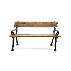 Rustic pine slatted and cast iron garden bench