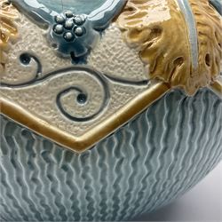 Burmantoft pottery jardiniere, moulded with leaf decoration and a lobed shell rim, upon a blue ground, with impress mark beneath H24cm 