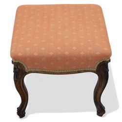 19th century mahogany framed footstool on floral carved cabriole supports upholstered in c...