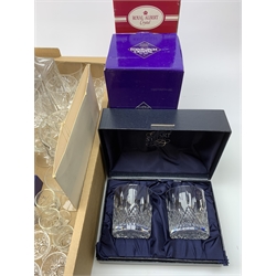 A large quantity of drinking glasses, to include a boxed pair of Royal Doulton tumblers, boxed set of six Stuart Crystal liquor glasses, boxed pair of Stuart Crystal tumblers, boxed pair of Stuart Crystal tall tumblers, together with various wine, brandy, sherry and liquor clear cut glasses, plus a boxed Royal Albert decanter, two further decanters, and a boxed Edinburgh Crystal jug. 