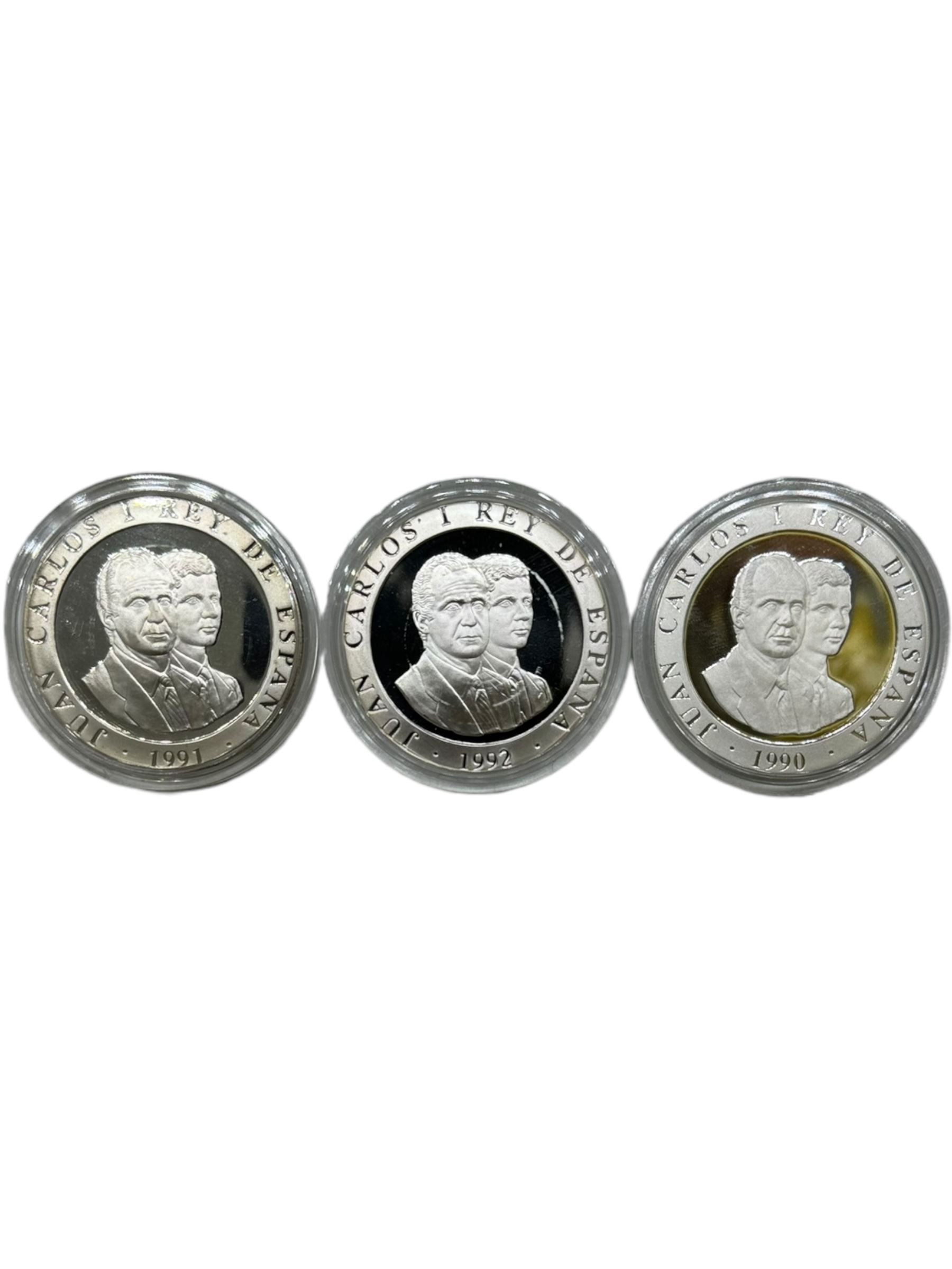 Twelve 'Olympic Commemorative' silver coins, including France 1990 'Slalom Skiing' one-hundred francs, China 1992 'Ski Jumper' ten yuan, Bhutan 1992 'Speed Skating' three-hundred ngultrums, Turks and Caicos Islands 1993 'Four-man Bobsleigh' twenty crowns etc, all with Westminster certificates
