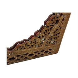 Large North African design carved and painted wall mirror, decorated with floral motifs, pierced foliate scrolls, inset mirrored panels, and colourful painted detailing, enclosing an oval bevelled mirror plate