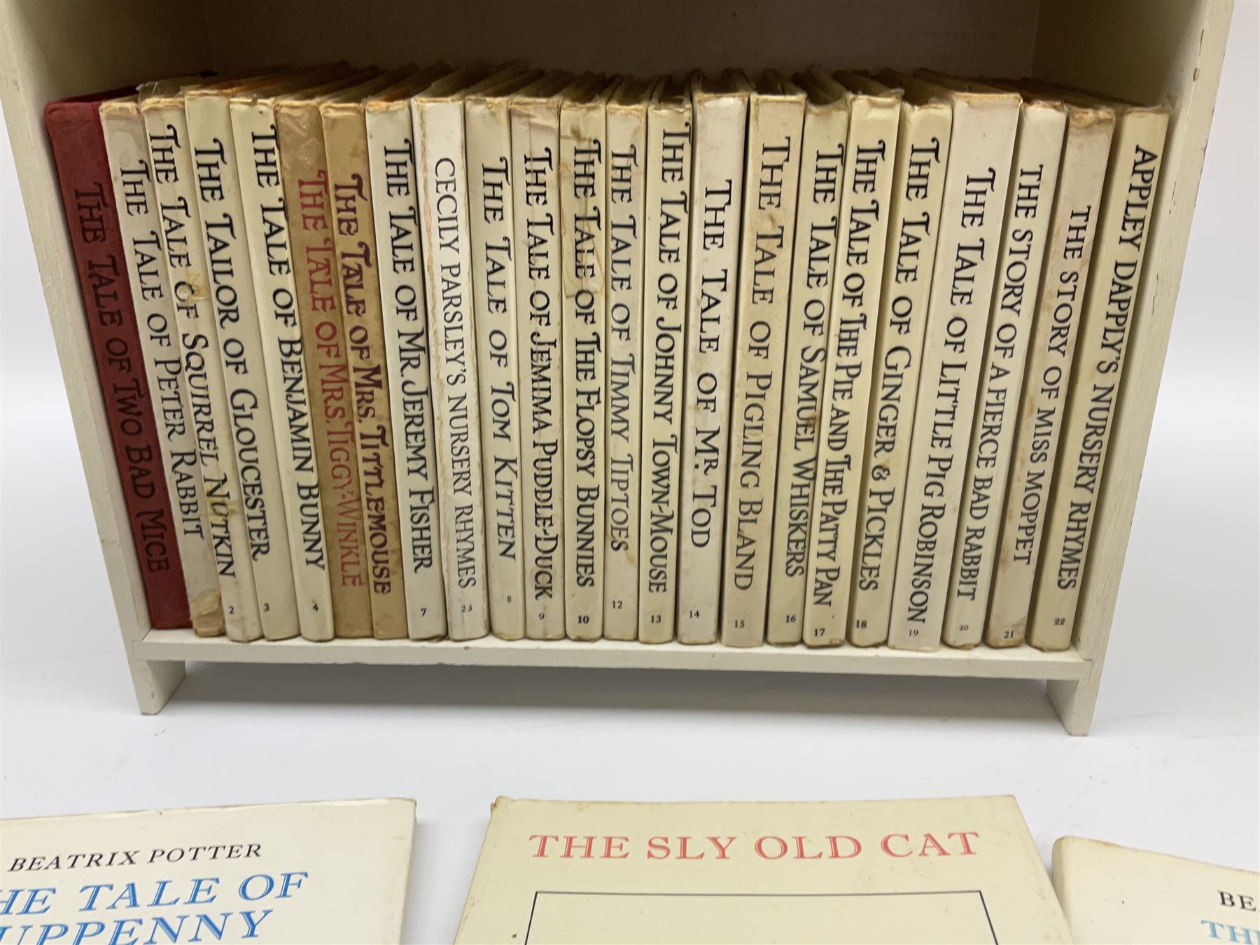 'Peter Rabbit's Book Shelf', containing selection of Beatrix Potter books, mostly library editions, shelf H29cm L27.5cm D11.5cm