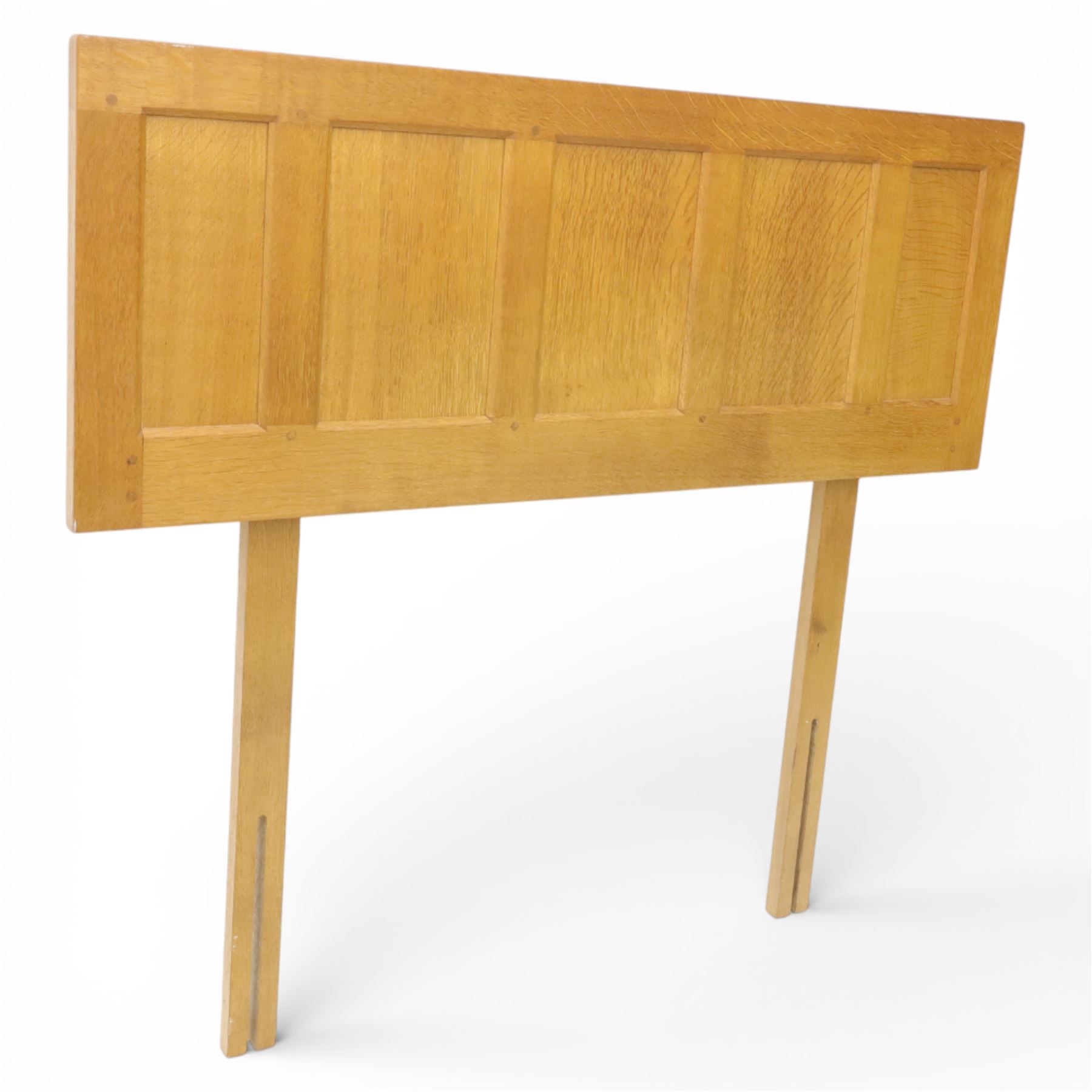 Yorkshire oak single headboard, the panelled back with visible dowls, raised upon plain supports 