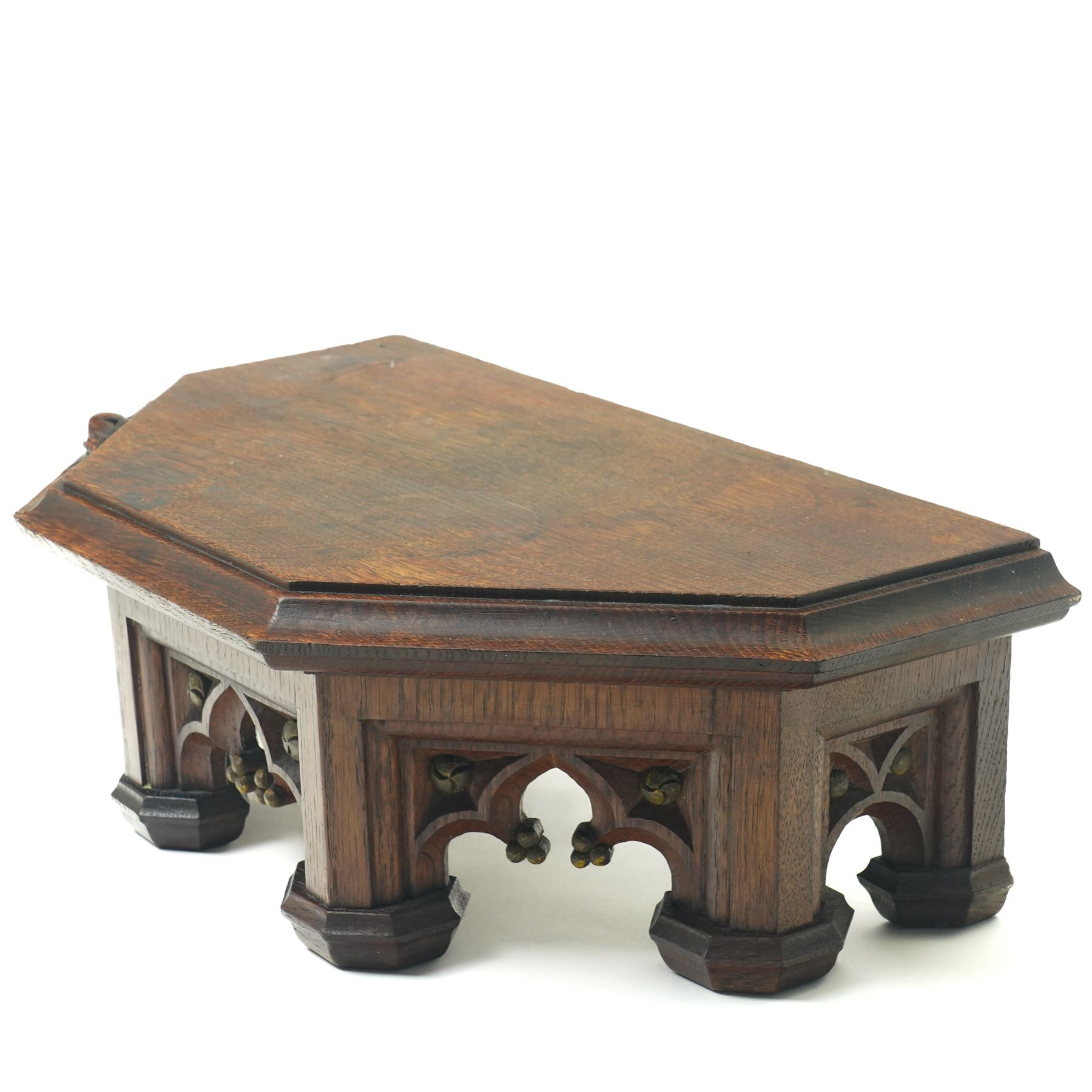 Mouseman - circa 1930s oak wedge shaped six sided plinth, of gothic design with carved berries and columnar supports, with carved mouse signature, by Robert Thompson of Kilburn