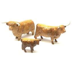 A Beswick Highland Bull, Highland Cow, and Highland Calf, each with printed mark beneath. 