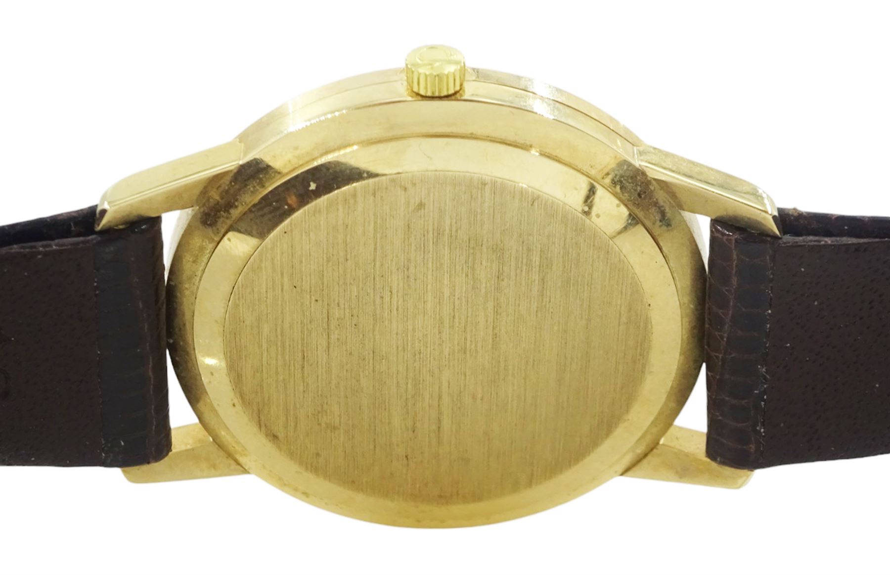 Omega gentleman's 9ct gold automatic wristwatch, silvered dial with baton hour markers and date aperture, on Omega brown leather strap, with Omega gold-plated buckle, boxed