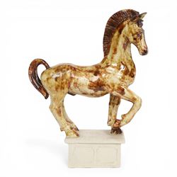 Owen Thorpe, studio pottery horse, standing with one leg raised, upon a rectangular plinth, H35cm 