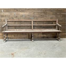 Victorian pitch pine bench pew, turned arms and legs, rail back with plank seat, 249cm
