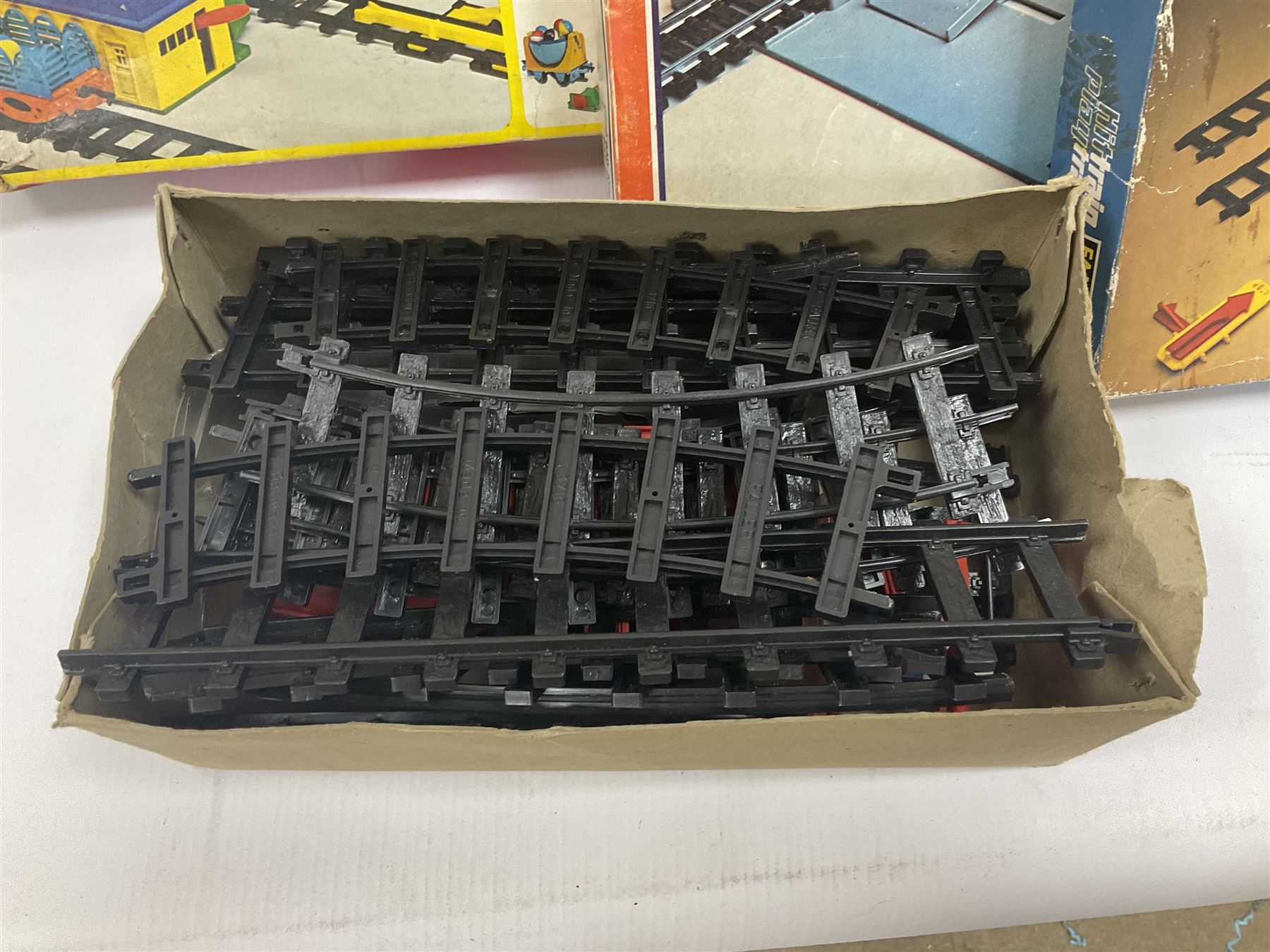 Large quantity of toy railway collectables, to include Faller ‘Hit Train’ boxed sets 3706, 3732, 3753; Lima automatic car unloader, quantity of track and accessories, etc in two boxes 