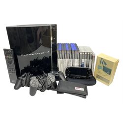 Sony PlayStation 3 60GB console with one PS3 controller, two PS2 controllers, BD remote control, PSP handheld gaming console with case, GAMEware PSP essentials pack, and a selection of PS2, PS3 and PSP games in original cases with instruction booklets 