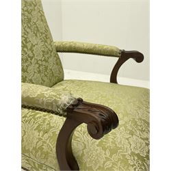 Gainsborough style open armchair, shaped cresting rail and back over curved arms with scroll carved terminals, upholstered in light green fabric with raised floral pattern, sprung serpentine seat with stud work, acanthus carved cabriole supports with ball and claw feet