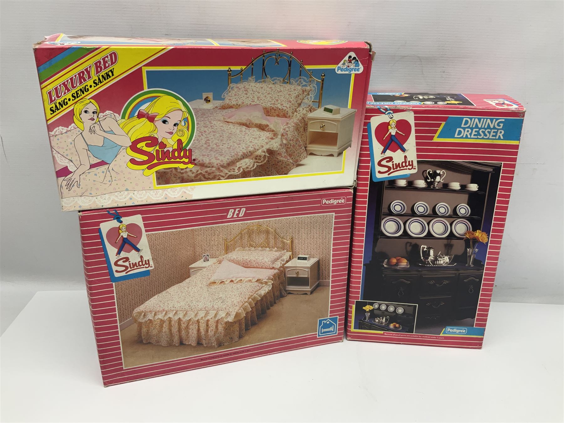 Sindy - furniture and accessories comprising dining suite with separate dresser; two beds; Garden Set; Music Centre; all  boxed; three-piece bedroom suite; settee; Hostess Trolley; two coffee tables; and four-piece bathroom suite including shower cubicle