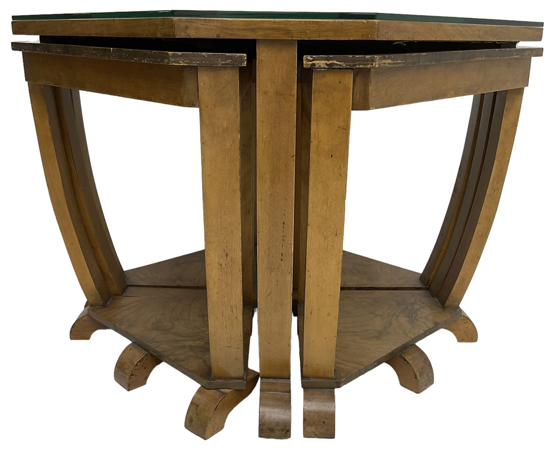 1930s Art Deco period walnut nest of tables, square canted top with segmental figured veneers forming flowerhead with birdseye maple centre, with four smaller nesting tables on arched supports united by undertier, on block feet